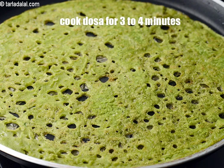 Step 16 – Cook the dosa on medium flame for 3 to 4 minutes or till crisp.