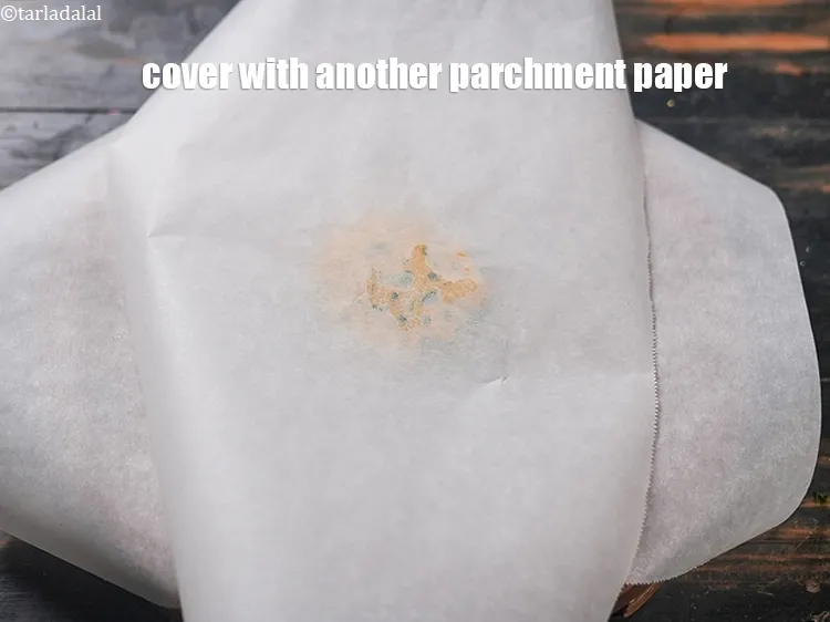 Step 16 – Cover with another parchment paper.