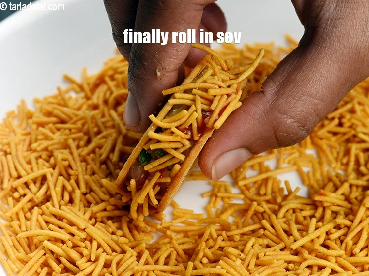 Step 16 – Finally roll in aloo bhujia sev.&nbsp;