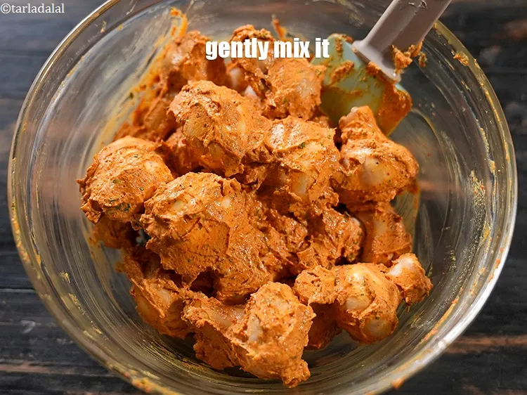 Step 16 – Gently mix it well with the marinade. Keep aside for 30 minutes.