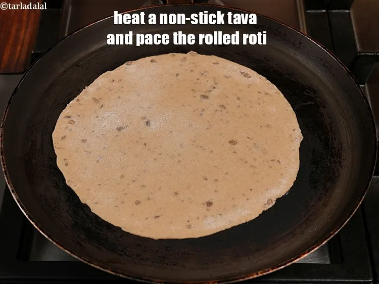 Step 16 – Heat a non-stick tava (griddle) and pace the rolled roti.