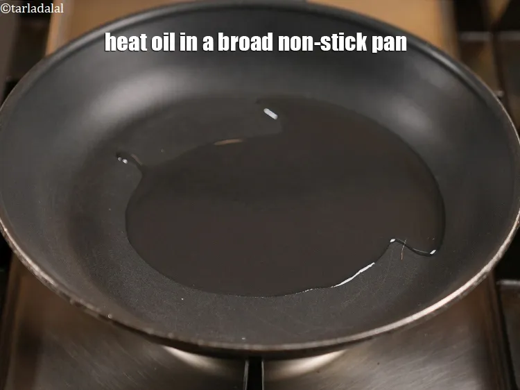 Step 16 – Heat 2 tbsp oil in a broad non stick pan.