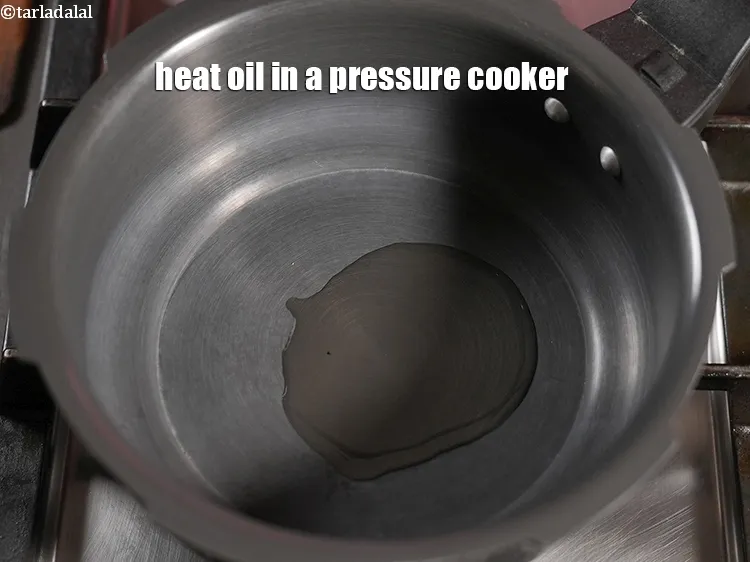 Step 16 – Heat 2 tsp oil in a pressure cooker.