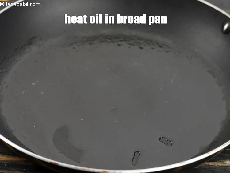 Step 16 – Heat 2 tsp oil in a broad non-stick pan.