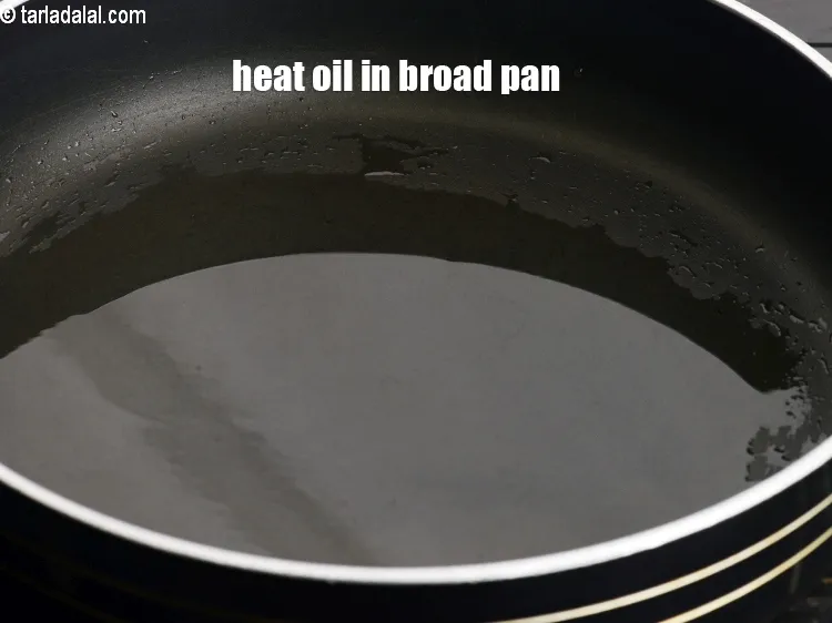 Step 17 – Heat 2 tsp oil in a broad non-stick pan.