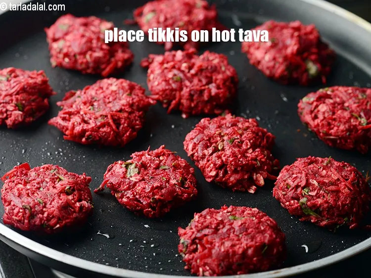 Step 17 – Immediately place the tikkis on the hot greased tava.&nbsp;