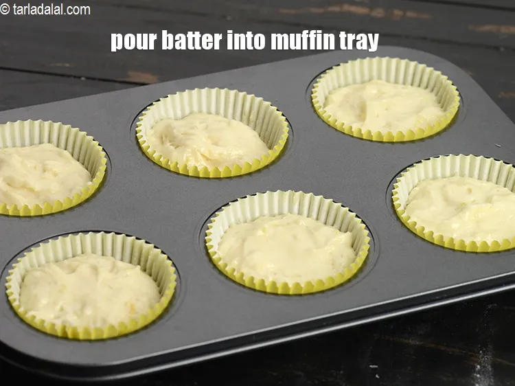 Step 18 – Pour equal quantities of batter into 9 lined muffin trays.