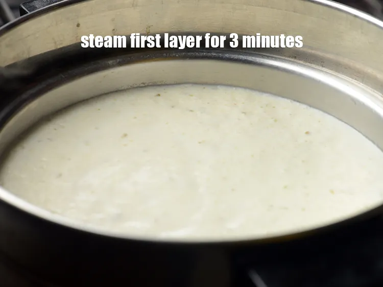 Step 17 – Steam the first layer of dhokla on medium flame for 3 minutes.