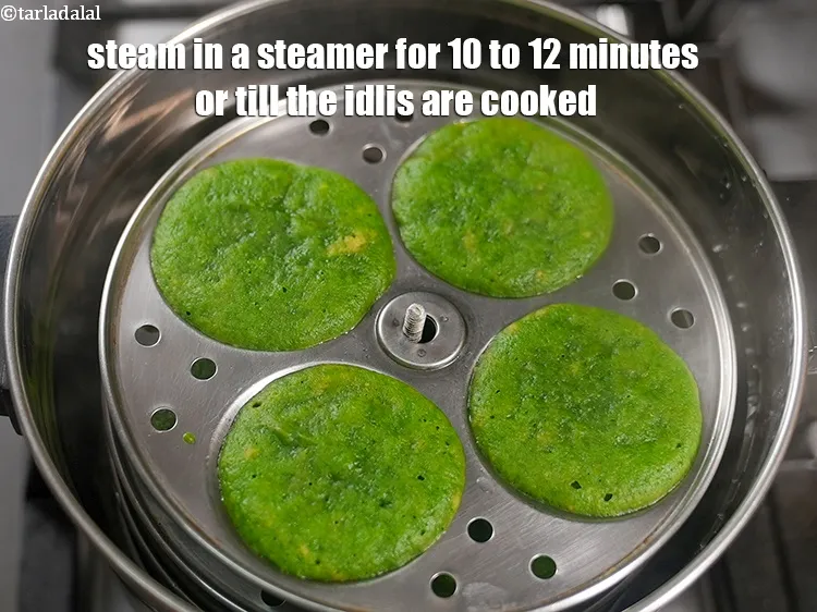 Step 16 – Steam in a steamer for 10 to 12 minutes or till the idlis are cooked.