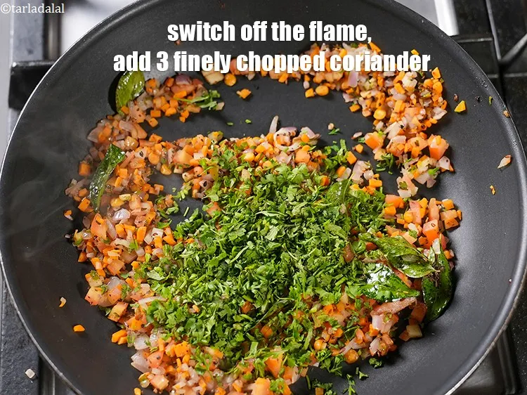 Step 16 – Switch off the flame, add 3 tbsp finely chopped coriander.