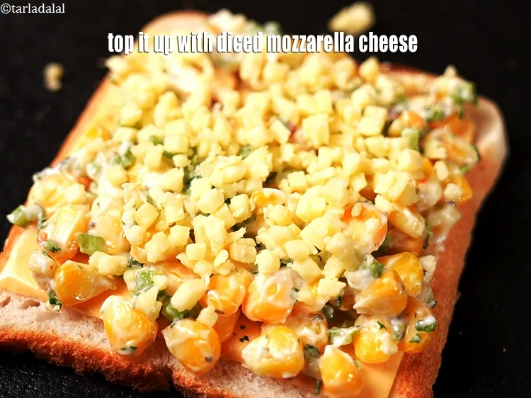 Step 16 – Top it up with 1 tbsp <a href="https://www.tarladalal.com/glossary-diced-mozzarella-cheese-2805i">diced mozzarella cheese</a>.