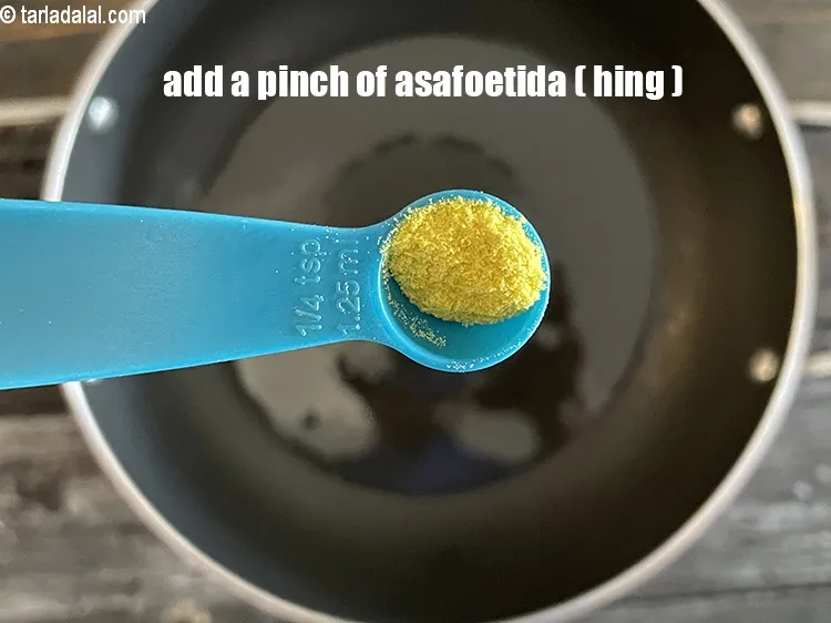 Step 17 – Add&nbsp;<meta charset="UTF-8" />a pinch of&nbsp;<a href="glossary-asafoetida-hing-113i">asafoetida (hing)</a>.