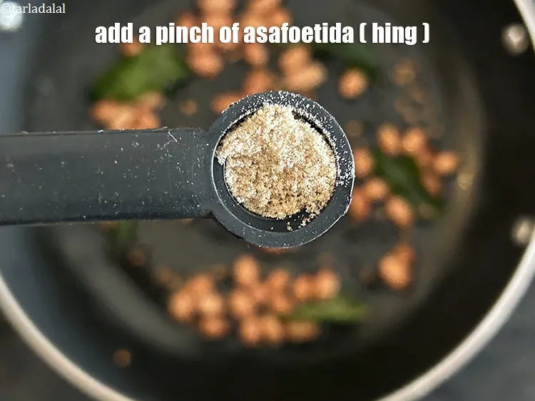 Step 17 – Add&nbsp;<meta charset="UTF-8" />a pinch of&nbsp;<a href="glossary-asafoetida-hing-113i">asafoetida (hing)</a>.