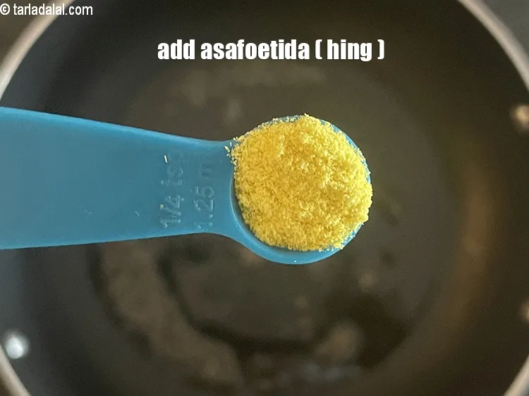 Step 18 – Add&nbsp;<meta charset="UTF-8" />1/4 tsp&nbsp;<a href="glossary-asafoetida-hing-113i">asafoetida (hing)</a>.