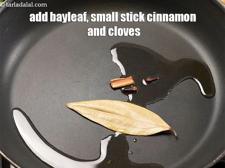Step 16 – Add 1 <a href="https://www.tarladalal.com/glossary-bay-leaf-tejpatta-bay-leaves-189i">bay leaf (tejpatta)</a>, 1 small&nbsp;<a href="https://www.tarladalal.com/glossary-cinnamon-dalchini-346i">cinnamon (dalchini)</a> stick and 2 <a href="https://www.tarladalal.com/glossary-cloves-laung-lavang-322i">cloves …