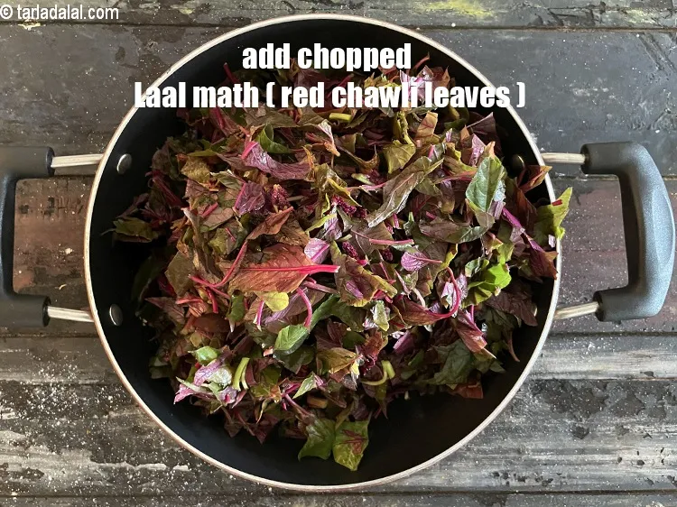 Step 22 – Add&nbsp;<meta charset="UTF-8" />4 cups&nbsp;<a href="glossary-chopped-red-chawli-leaves-2738i">chopped red chawli (cow pea) leaves</a>.