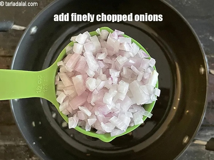 Step 26 – Add&nbsp;<meta charset="UTF-8" />1/2 cup&nbsp;finely&nbsp;<a href="glossary-chopped-onions-722i">chopped onions</a>.