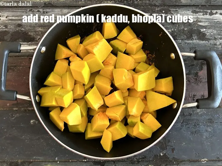 Step 17 – Add&nbsp;<meta charset="UTF-8" />4 cups&nbsp;<a href="glossary-red-pumpkin-cubes-1530i">red pumpkin (bhopla / kaddu) cubes</a>.