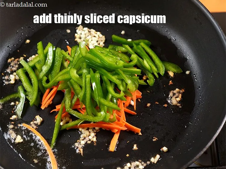 Step 17 – Add &frac34; cup thinly <a href="https://www.tarladalal.com/glossary-sliced-capsicum-165i">sliced capsicum</a>.