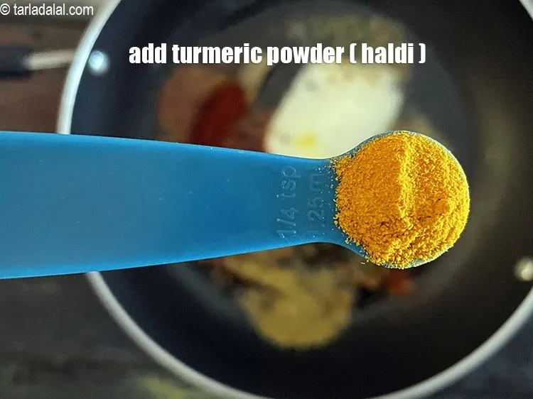 Step 16 – Add&nbsp;<meta charset="UTF-8" />1/4 tsp&nbsp;<a href="glossary-turmeric-powder-haldi-645i">turmeric powder (haldi)</a>.