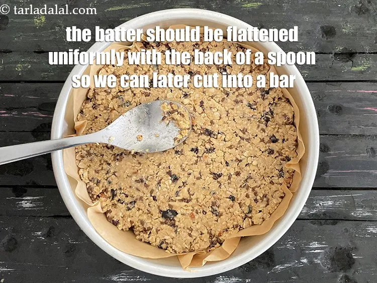 Step 24 – The batter for the oats bar should be flatened with the back of a spoon …