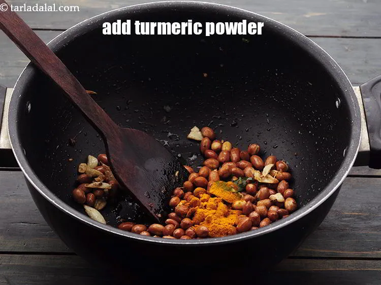 Step 15 – Add the <a href="https://www.tarladalal.com/glossary-turmeric-powder-haldi-645i" target="_blank">turmeric powder</a>.