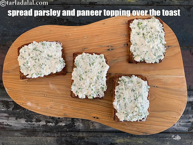 Step 17 – Spread the&nbsp;parsley and cottage cheese topping evenly over the toast.