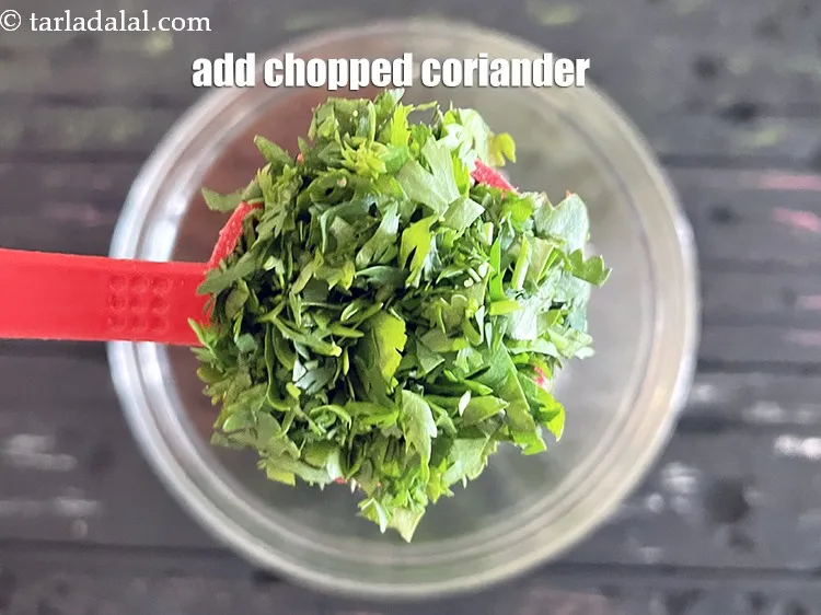 Step 16 – Add&nbsp;<meta charset="UTF-8" />1 tbsp&nbsp;finely&nbsp;<a href="glossary-chopped-coriander-783i">chopped coriander (dhania)</a>.