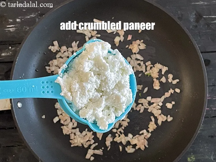 Step 25 – Add&nbsp;<meta charset="UTF-8" />1/2 cup&nbsp;<a href="glossary-crumbled-paneer-997i">crumbled paneer (cottage cheese)</a>.