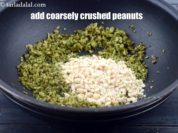 Step 16 – Add&nbsp;2 tbsp&nbsp;coarsely&nbsp;<a href="https://www.tarladalal.com/glossary-crushed-raw-peanuts-917i">crushed peanuts</a>.