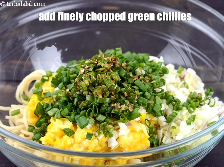 Step 17 – Add 1 tbsp finely <a href="https://www.tarladalal.com/glossary-chopped-green-chilli-820i">chopped green chillies</a>.