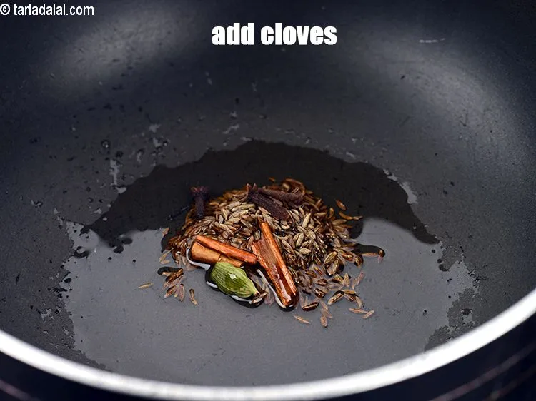 Step 16 – Add 3 cloves.