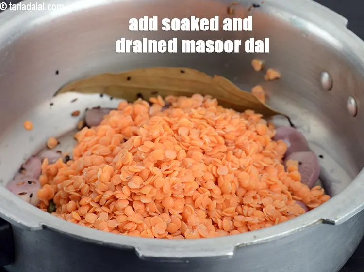 Step 16 – Add the soaked and drained masoor dal.