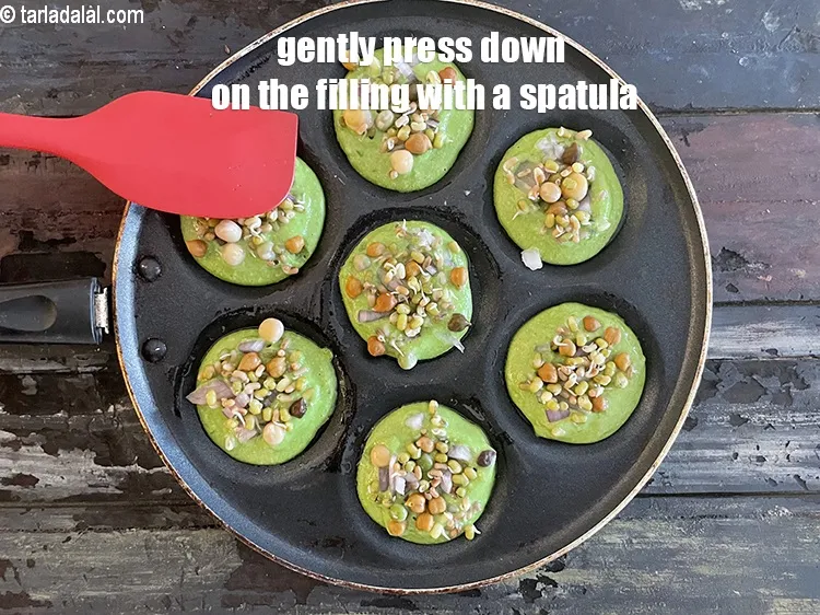 Step 23 – Gently press topping down with a spatula.&nbsp;