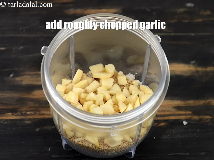Step 16 – Add 2 tbsp&nbsp;roughly&nbsp;<a href="https://tarladalal.com/glossary-chopped-garlic-790i">chopped garlic (lehsun)</a>.&nbsp;