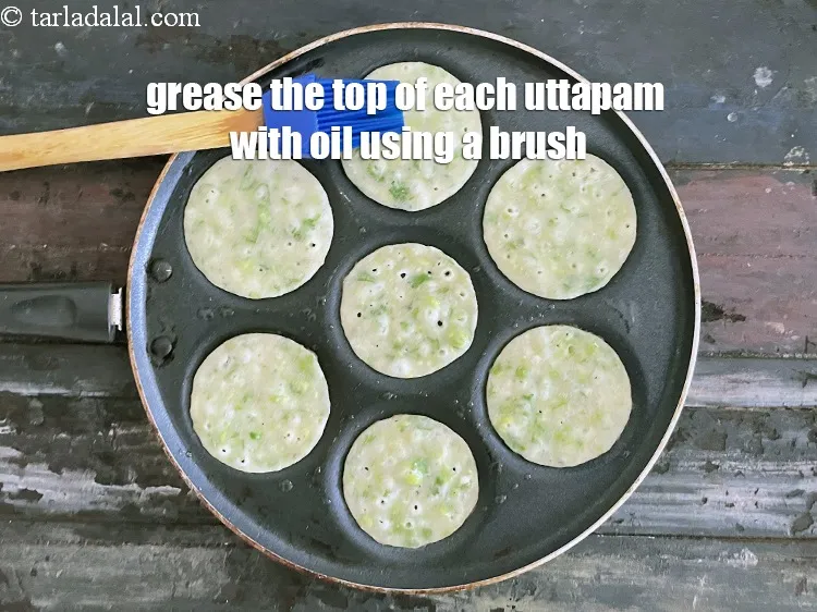 Step 28 – Grease the top of each uttapam using a brush with little oil.