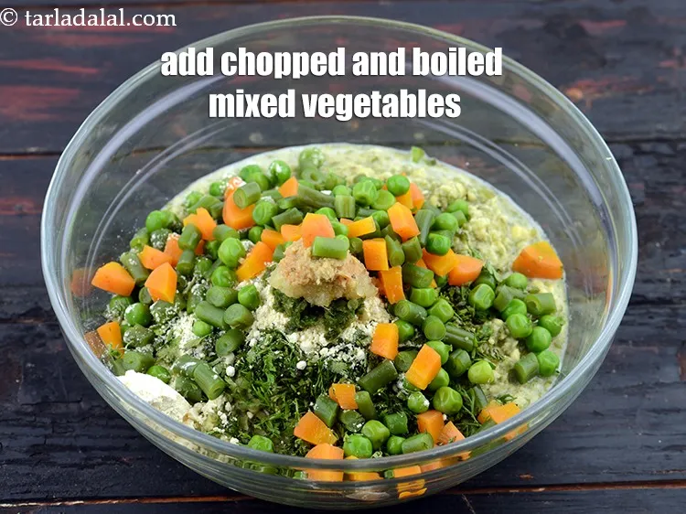 Step 16 – Add 1/2 cup&nbsp;<a href="https://www.tarladalal.com/glossary-chopped-and-boiled-mixed-vegetables-1884i">chopped and boiled mixed vegetables</a>