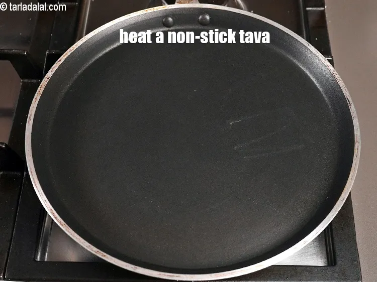 Step 19 – <meta charset="UTF-8" />Heat a non-stick tava (griddle).