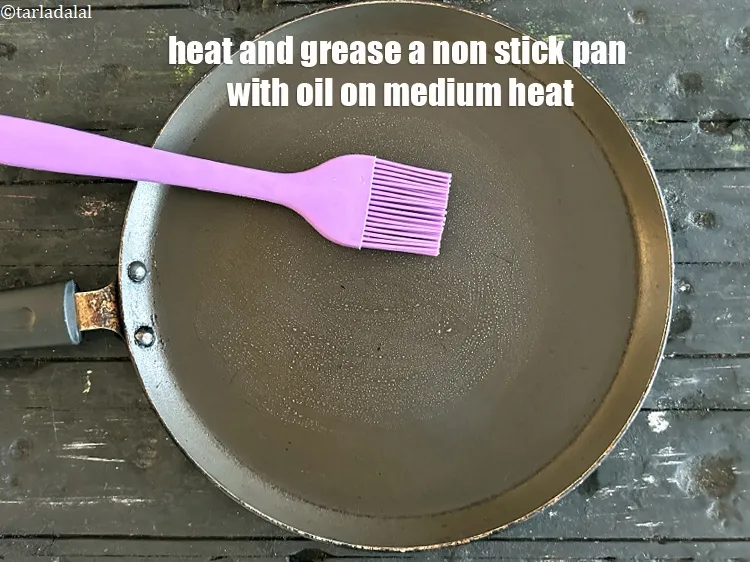 Step 24 – Heat and grease a non-stick tava on a medium flame.