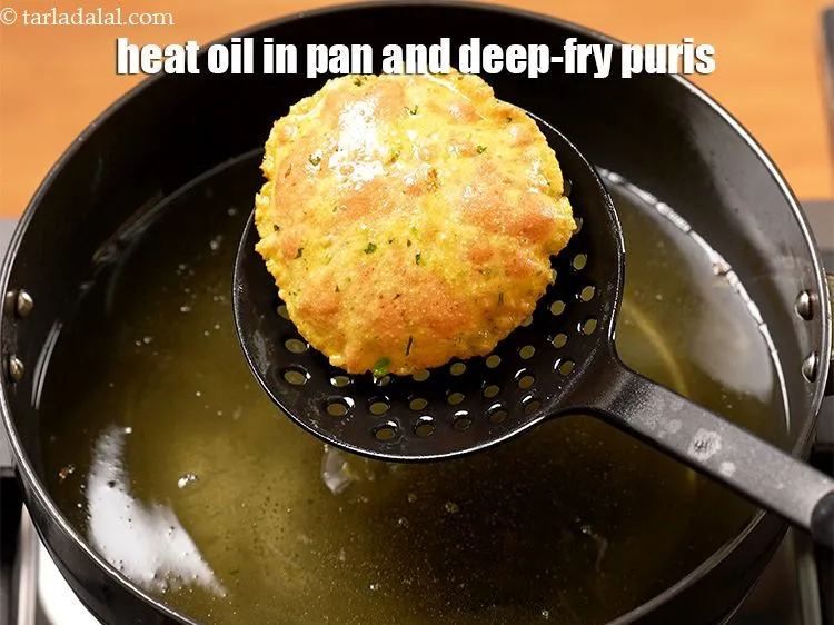 Step 16 – Heat the oil in a deep non-stick pan and deep-fry a few puris at a …