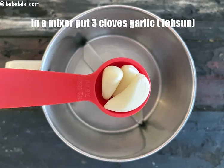 Step 16 – In a mixer put&nbsp;<meta charset="UTF-8" />3&nbsp;<a href="glossary-garlic-cloves-1857i">garlic (lehsun) cloves</a>.