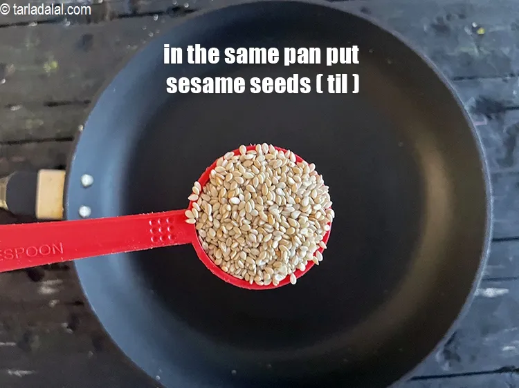 Step 16 – <meta charset="UTF-8" /> Add 2 tbsp&nbsp;<a href="glossary-sesame-seeds-til-gingelly-seeds-612i">sesame seeds (til)</a> into the same pan.