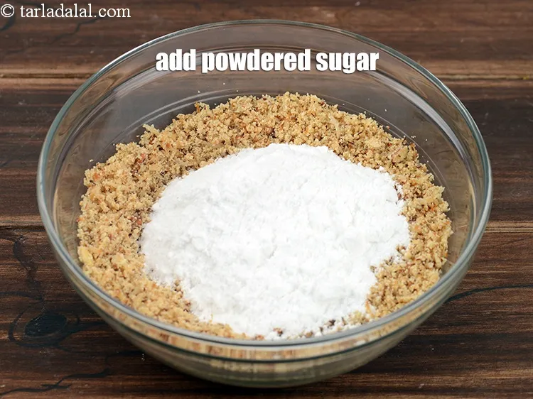Step 18 – Add 1 cup <a href="https://www.tarladalal.com/glossary-powdered-sugar-280i">powdered sugar</a>.&nbsp;