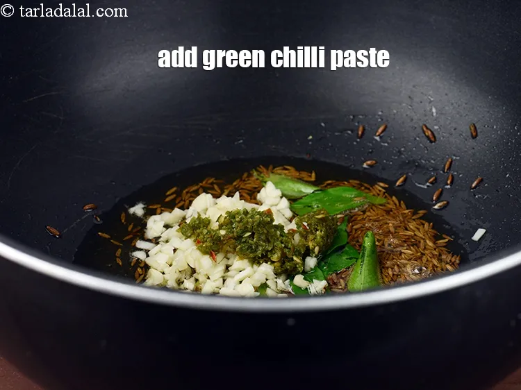 Step 17 – Add &frac12; tsp <a href="https://www.tarladalal.com/glossary-green-chilli-paste-hari-mirch-ki-paste-mirchi-paste-333i">green chilli paste</a>.