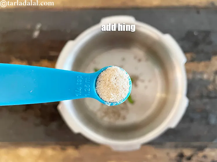 Step 33 – Add&nbsp;<meta charset="UTF-8" />1/4 tsp&nbsp;<a href="glossary-asafoetida-hing-113i">asafoetida (hing)</a>.