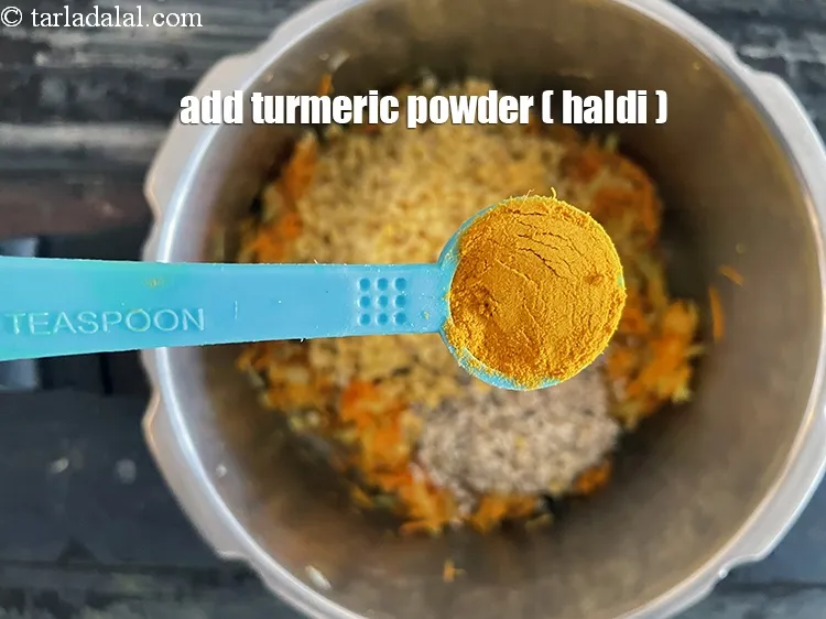 Step 25 – Add&nbsp;<meta charset="UTF-8" />1/2 tsp&nbsp;<a href="glossary-turmeric-powder-haldi-645i">turmeric powder (haldi)</a>.