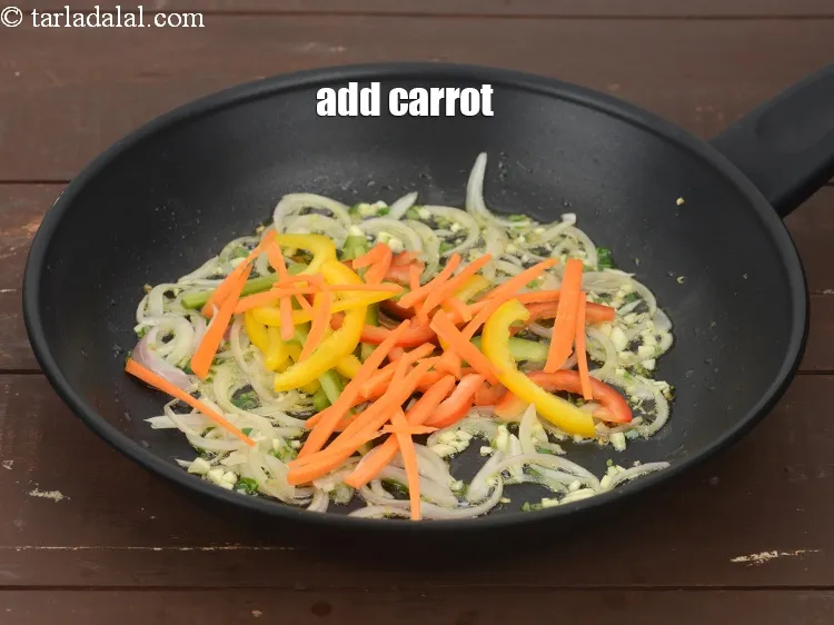 Step 16 – Add 1/4 cup&nbsp;thinly sliced&nbsp;<a href="https://www.tarladalal.com/glossary-carrot-gajar-gajjar-253i">carrot</a>.&nbsp;