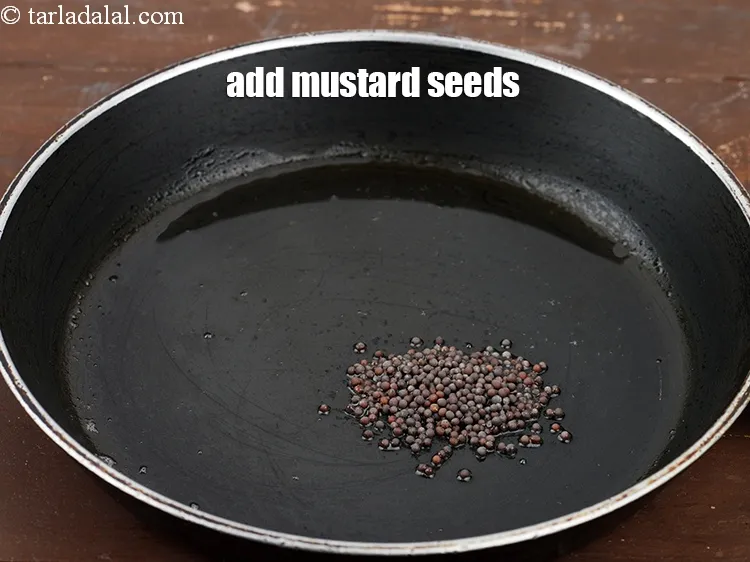 Step 16 – Add 1/2 tsp <a href="https://www.tarladalal.com/glossary-mustard-seeds-sarson-rai-sarson-ke-beej-525i">mustard seeds ( rai / sarson)</a>.