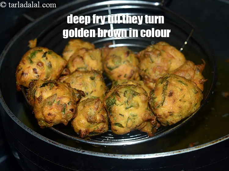 Step 16 – Deep fry on a medium flame till they turn golden brown in colour from all …