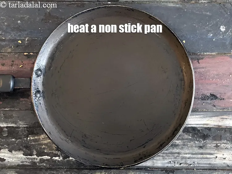 Step 18 – Heat a non-stick tava (griddle).